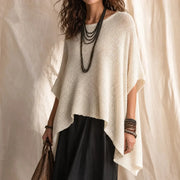 Solvera – Open Gebreide Batwing Top met Asymmetrische Zoom