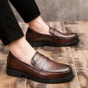 Jasper | Heren penny loaferschoenen met brogue details